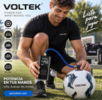 Man using the Voltek portable device to inflate a football outdoors